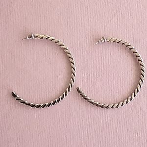 Native American crafted silver hoop earrings.